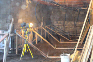 Shoring up walls and forms for underpinning a foundation.